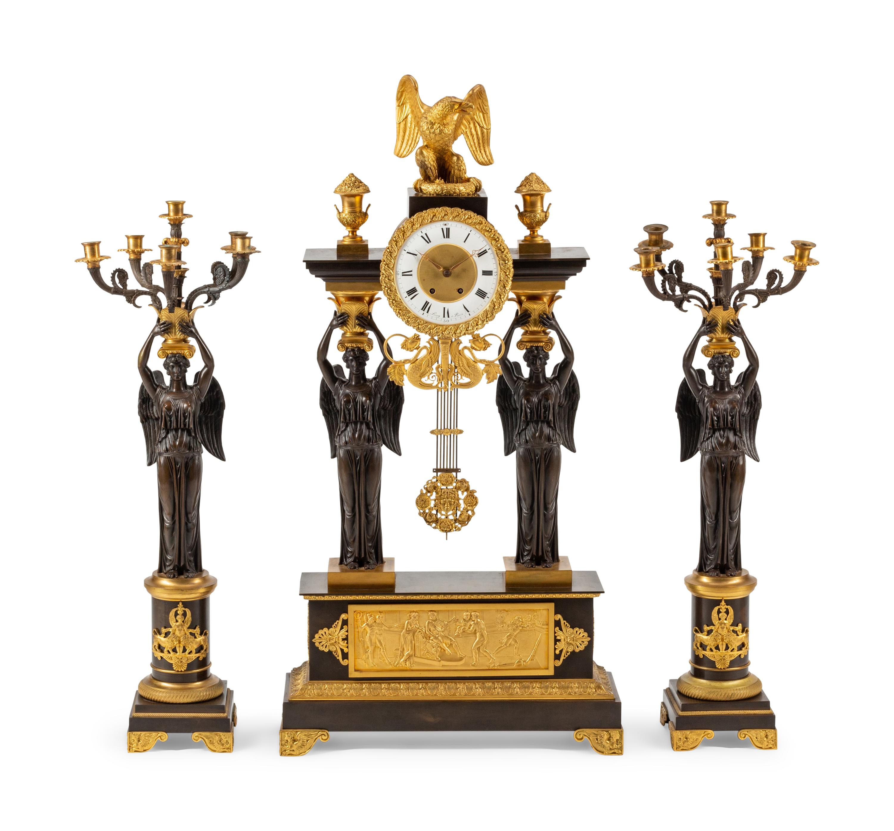 A Large Empire Style Gilt and Patinated Bronze Clock Garniture