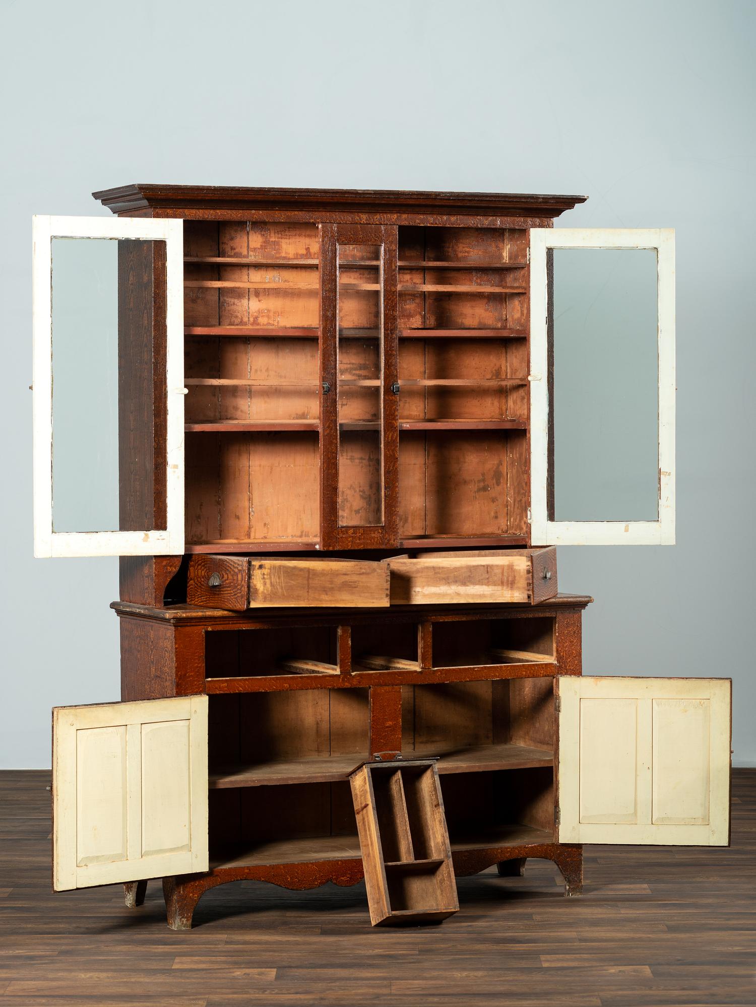 A Country Grain Paint Decorated Poplar Step-Back Cupboard