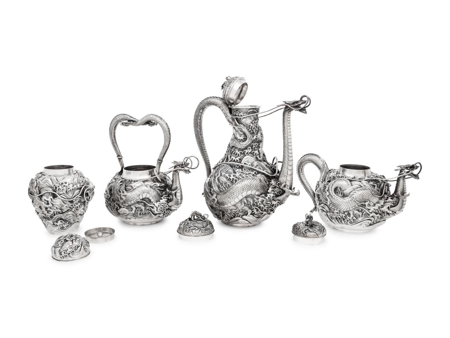 An Ornate Japanese Export Silver Eight-Piece Tea and Coffee Service