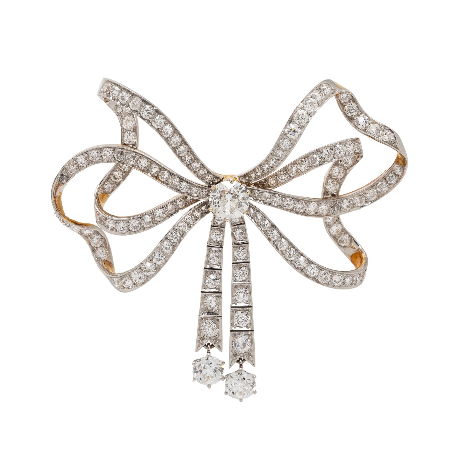 EDWARDIAN, DIAMOND AND PLATINUM-TOPPED GOLD BOW BROOCH