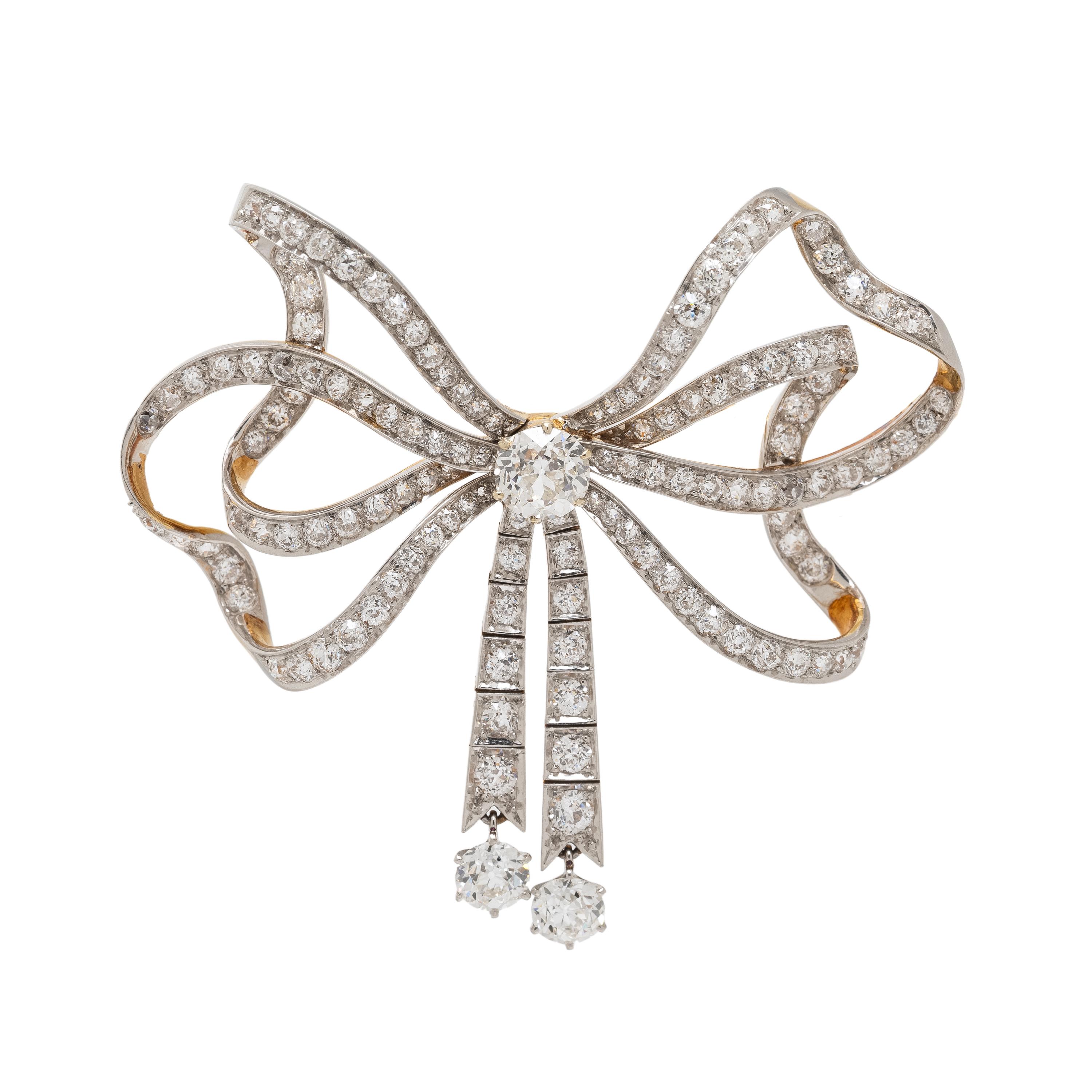 EDWARDIAN, DIAMOND AND PLATINUM-TOPPED GOLD BOW BROOCH