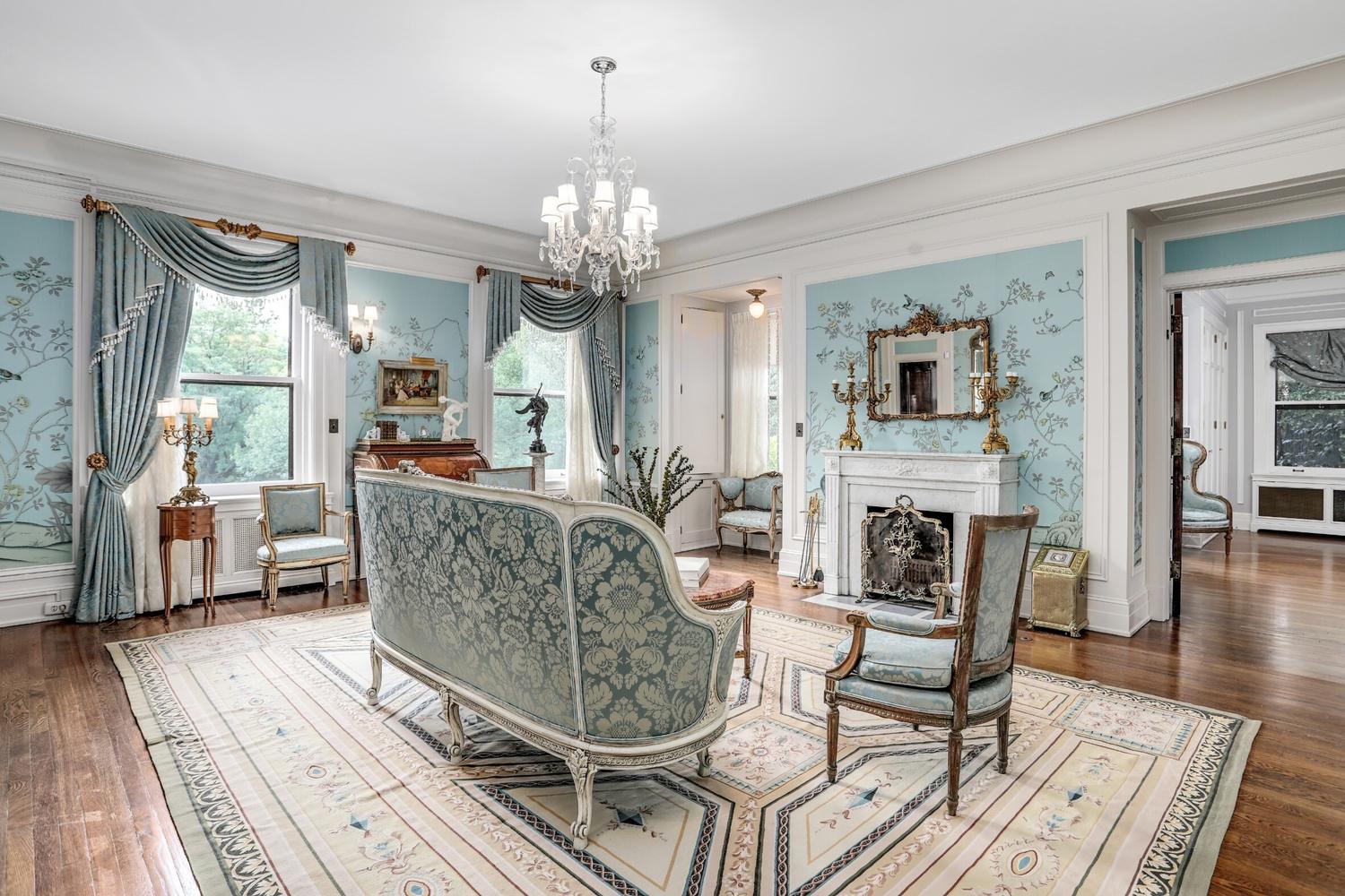 A Pair of Neoclassical Cast Metal Candlesticks