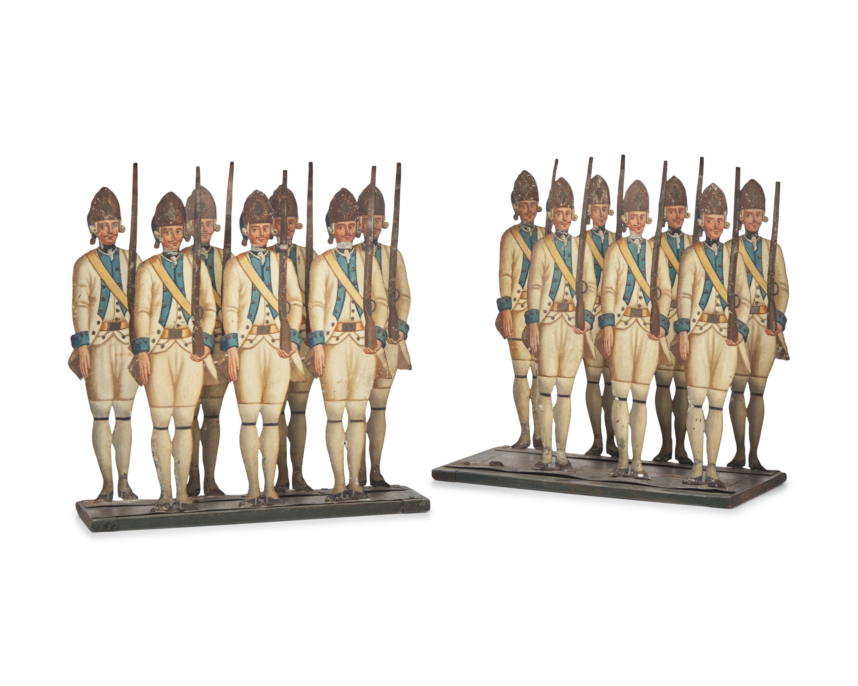 A Group of Fourteen Lithographed Tin Toy Figures of French Grenadiers