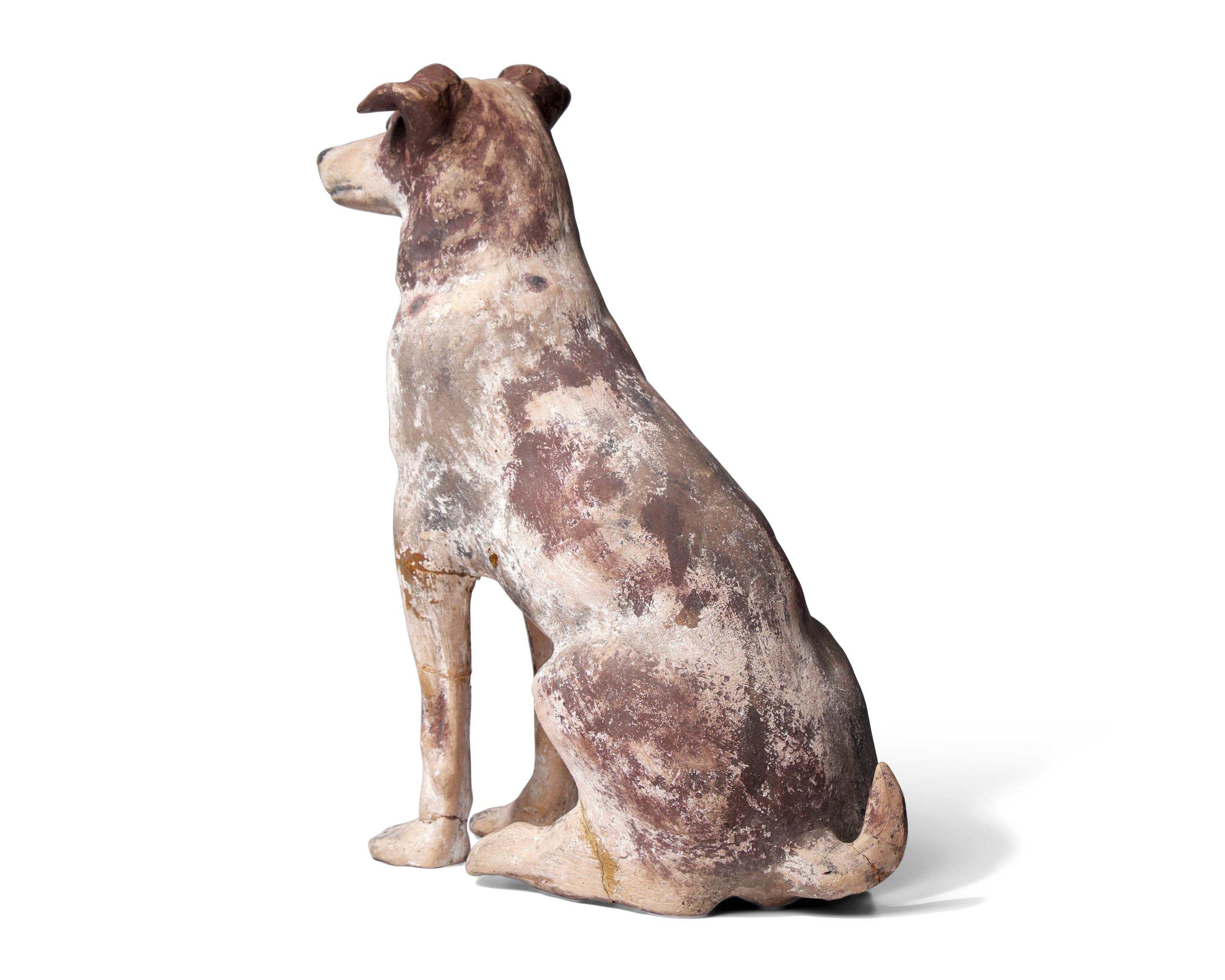 A Painted Terracotta Figure of a Dog