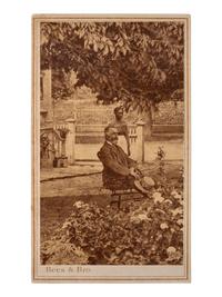 [AFRICAN AMERICANA]. Early post-bellum CDV of a female African American domestic worker standing in a garden behind a seated white gentleman. Richmond, VA: C. R. Rees & Bro, [1866].
