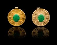 A Pair of 14 Karat Gold and Jadeite Cufflinks Length 3/4 inches.