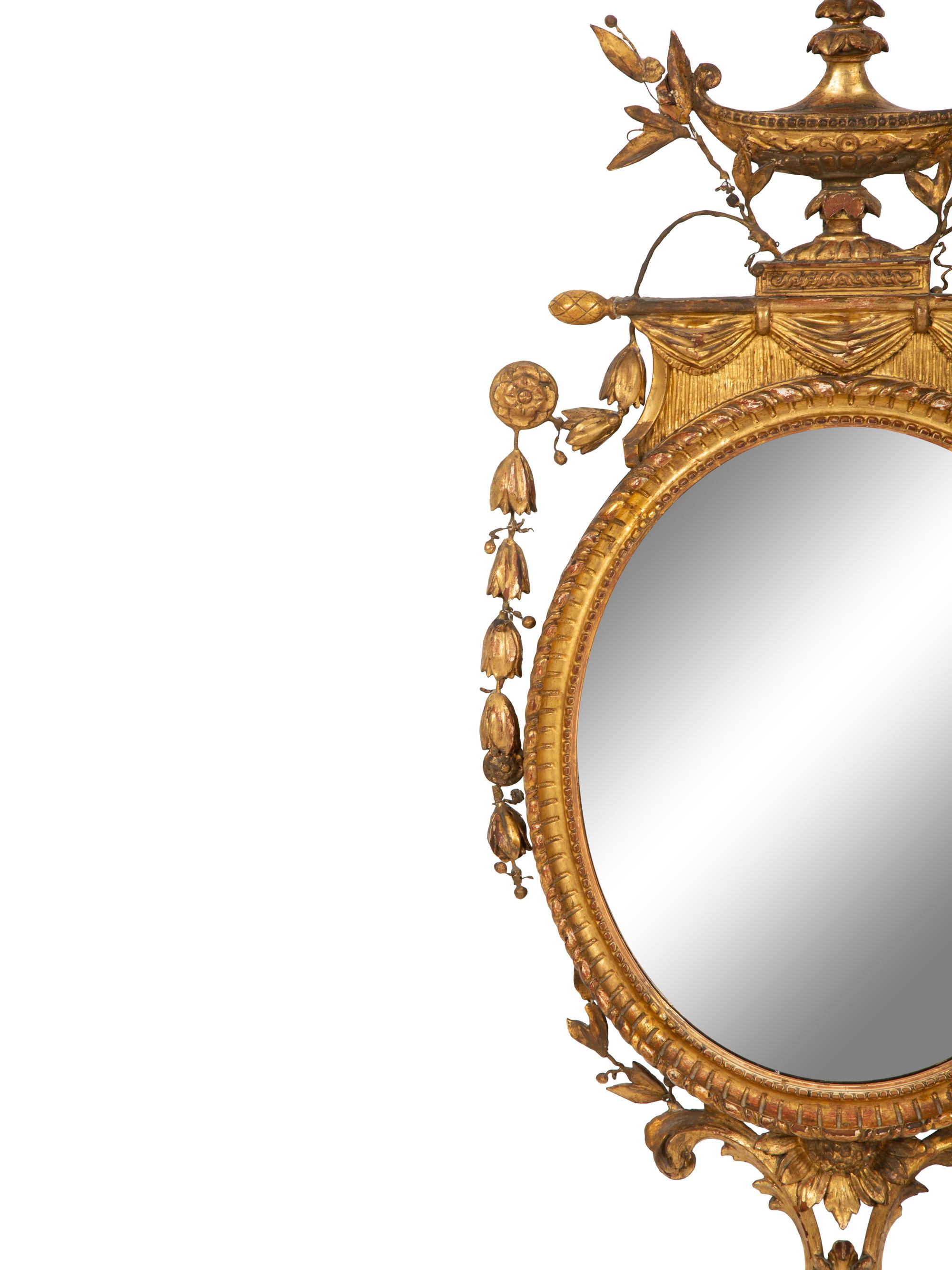 A Neoclassical Style Giltwood Oval Mirror