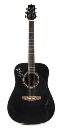 A Johnny Cash Autographed Guitar Length 41 1/2 inches.