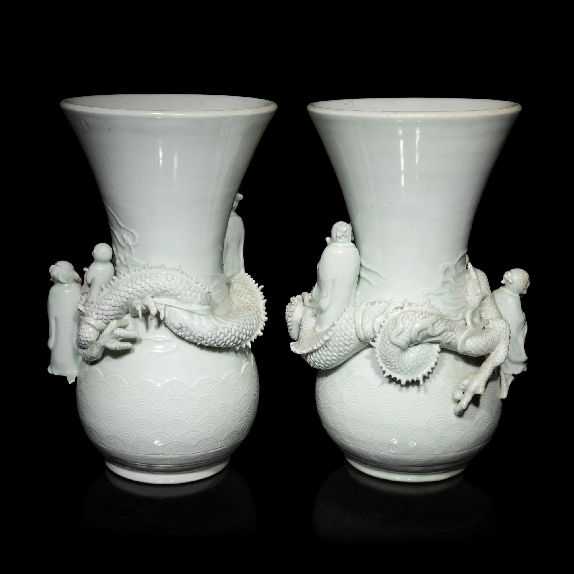 A Pair of Japanese Hirado Molded White Glazed Porcelain Vases, Meiji Period 明治時期 日本鍋島燒白釉龍紋瓶一對