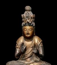 A Gilt Lacquered Wood Figure of Seated Kannan