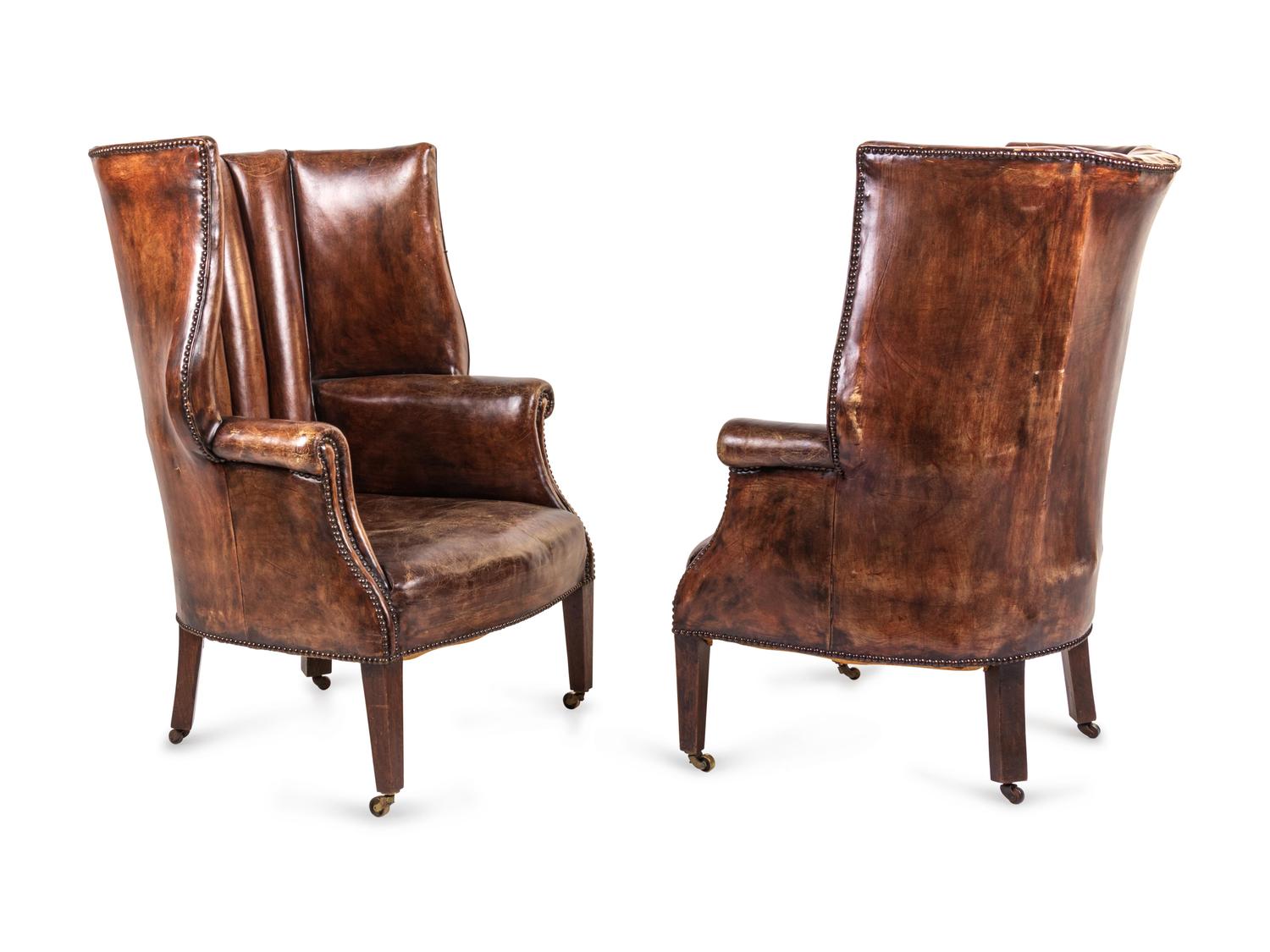 A Pair of Edwardian Leather-Upholstered Wingback Armchairs