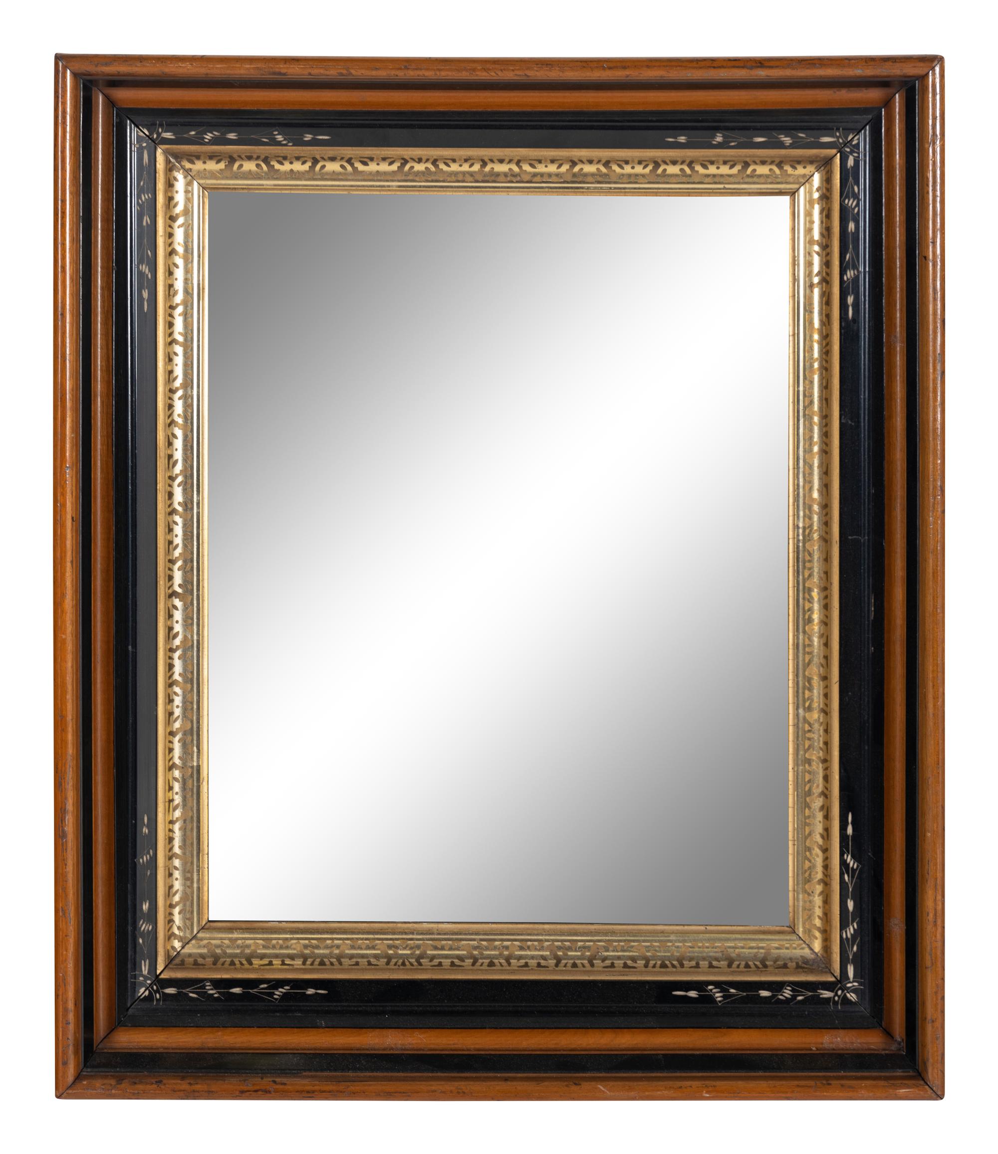 A Continental Walnut Parcel-Gilt and Ebonized Mirror
