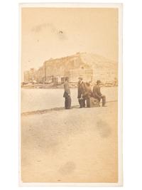 CDV featuring men sitting atop a large format camera on the sand bar in front of Ft. Sumter by H.C. Foster, Charleston, SC.