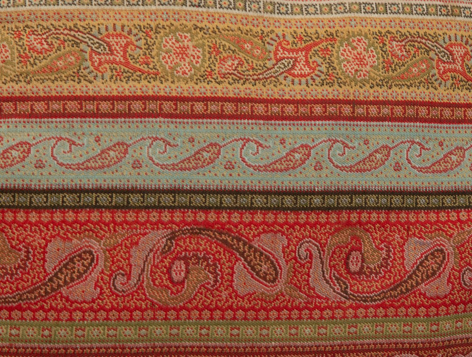 An Indian Paisley Wool Coverlet and Six Pillows