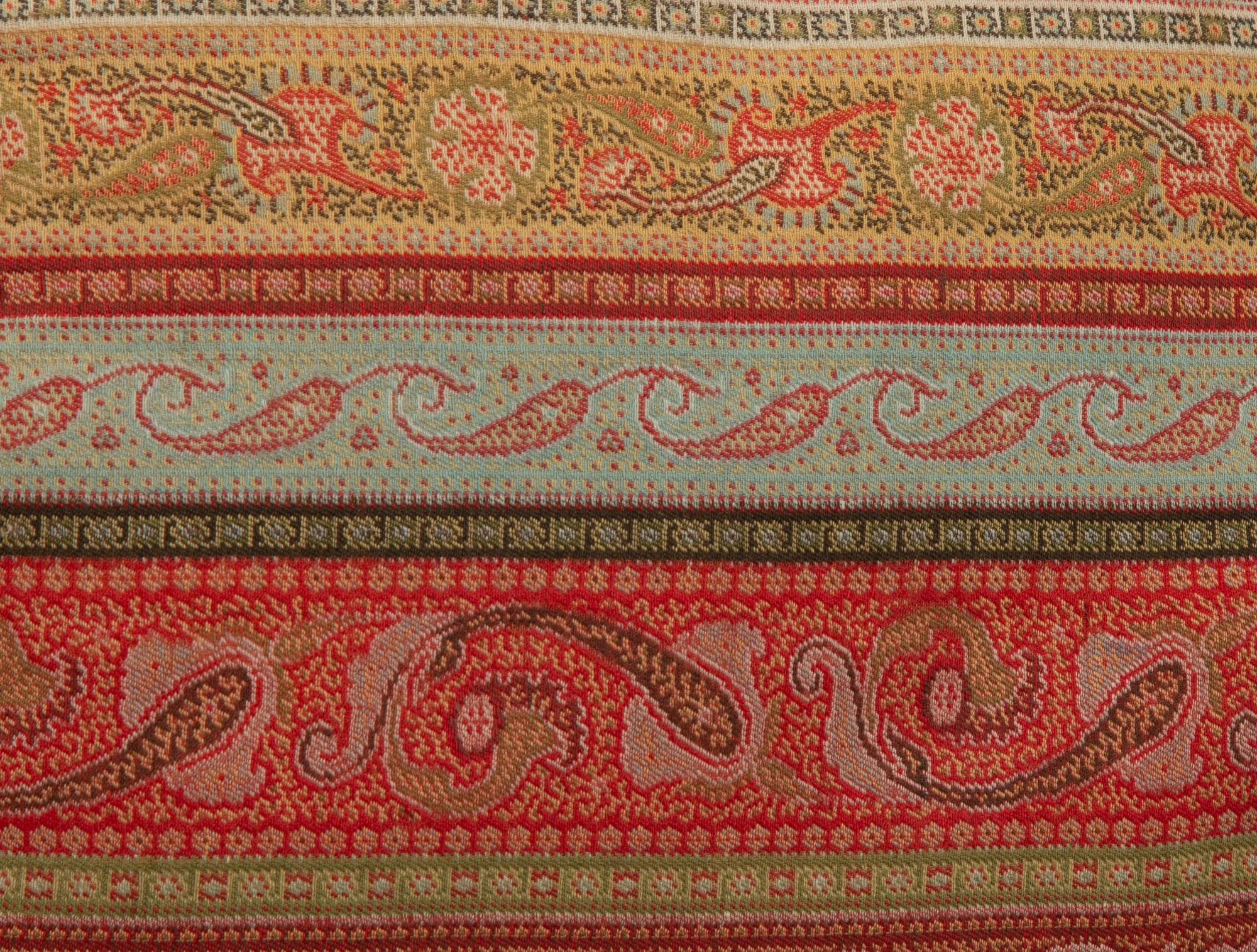 An Indian Paisley Wool Coverlet and Six Pillows