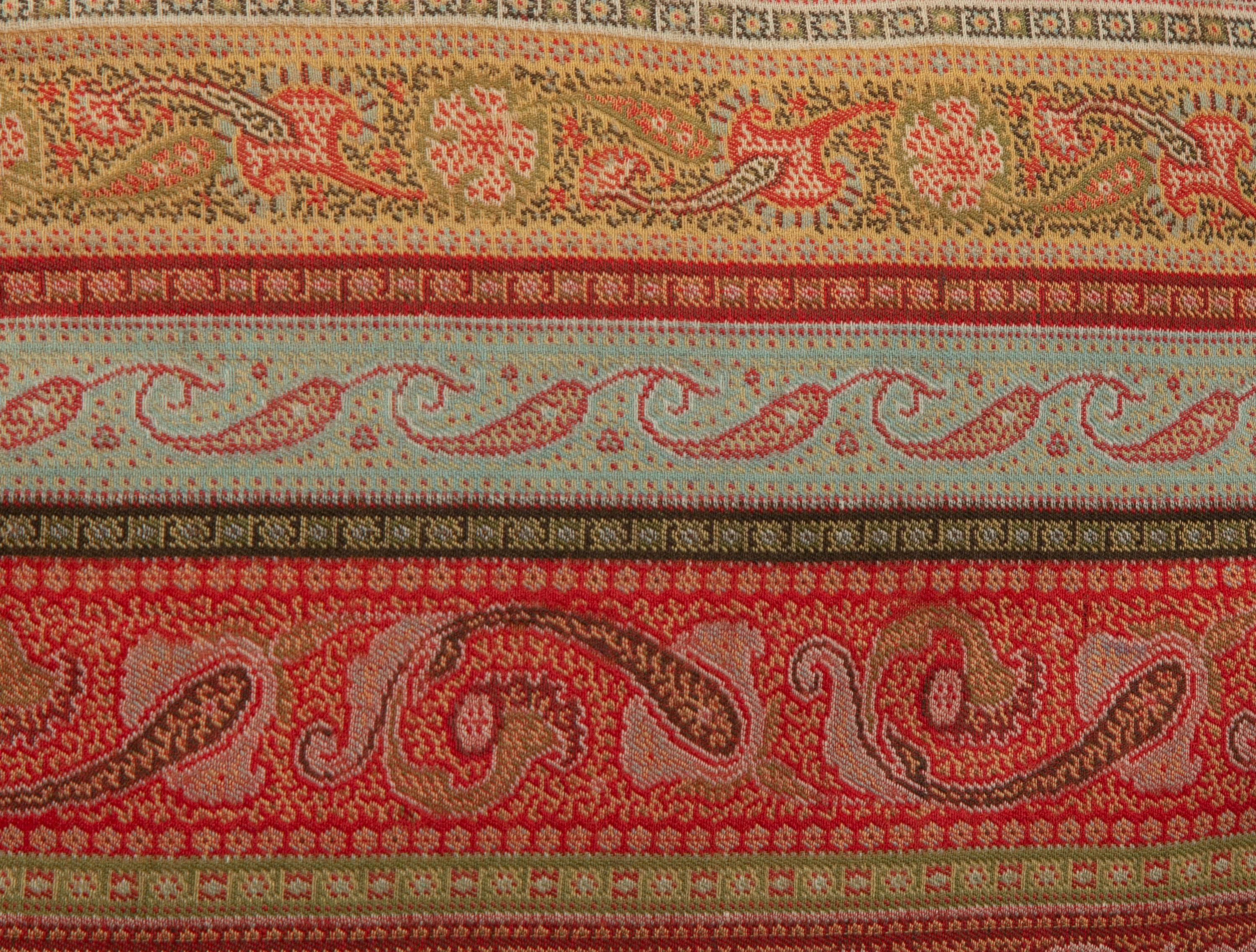 An Indian Paisley Wool Coverlet and Six Pillows