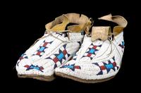 A Pair of Cheyenne Fully Beaded Moccasins Length 10 1/2 inches. — CIRCA 1885