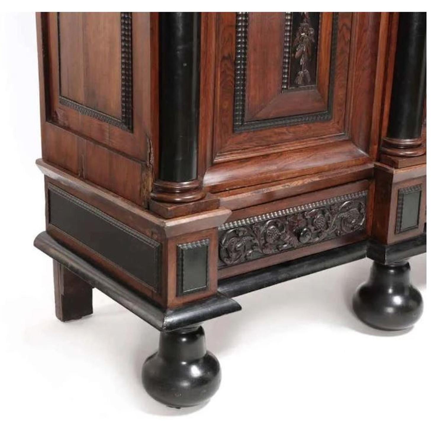 A Flemish Part-Ebonized Carved Rosewood Armoire — 17TH/18TH CENTURY