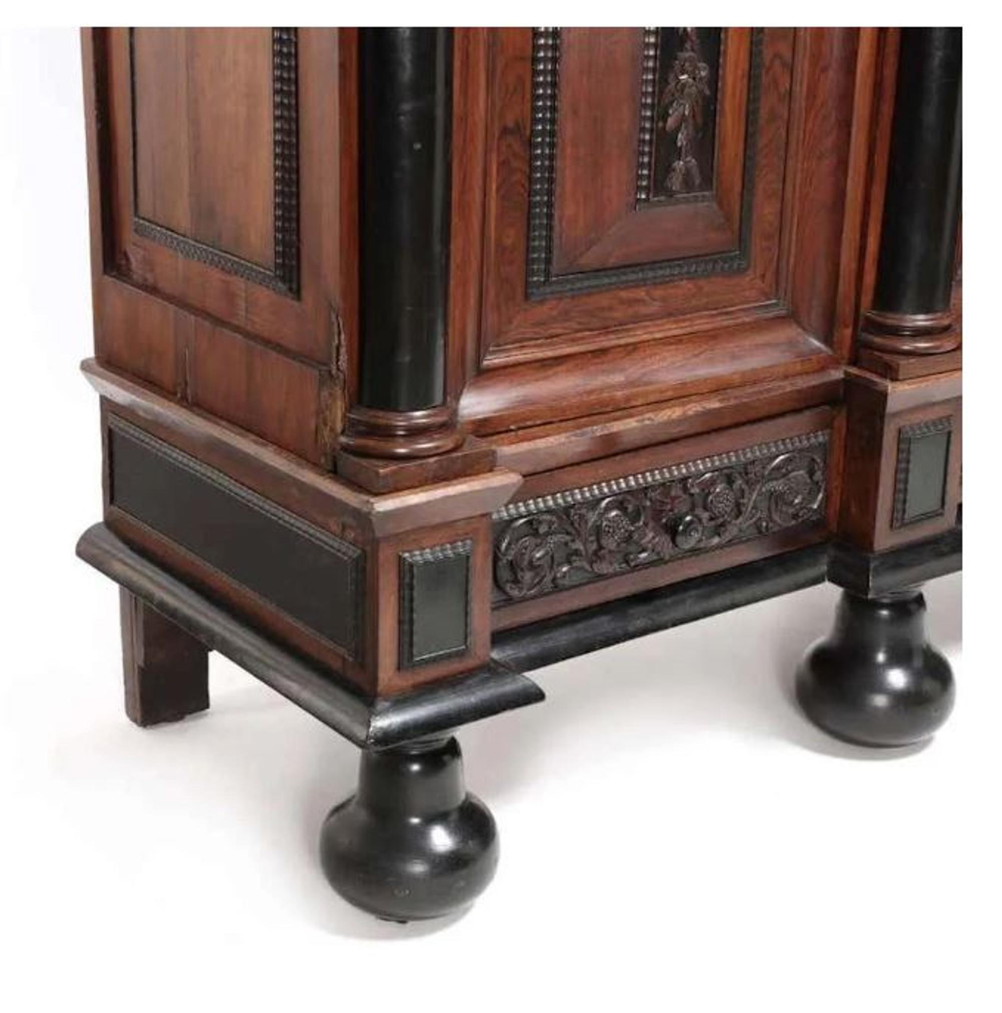 A Flemish Part-Ebonized Carved Rosewood Armoire — 17TH/18TH CENTURY