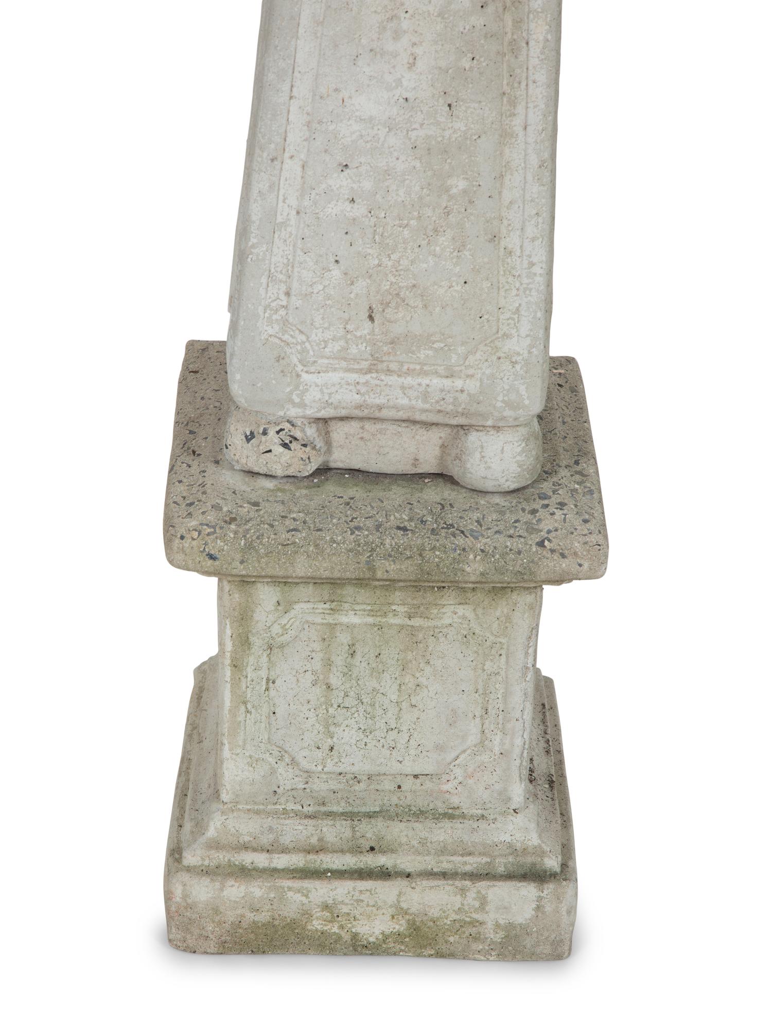 A Pair of Cast Stone Obelisks on Bases
