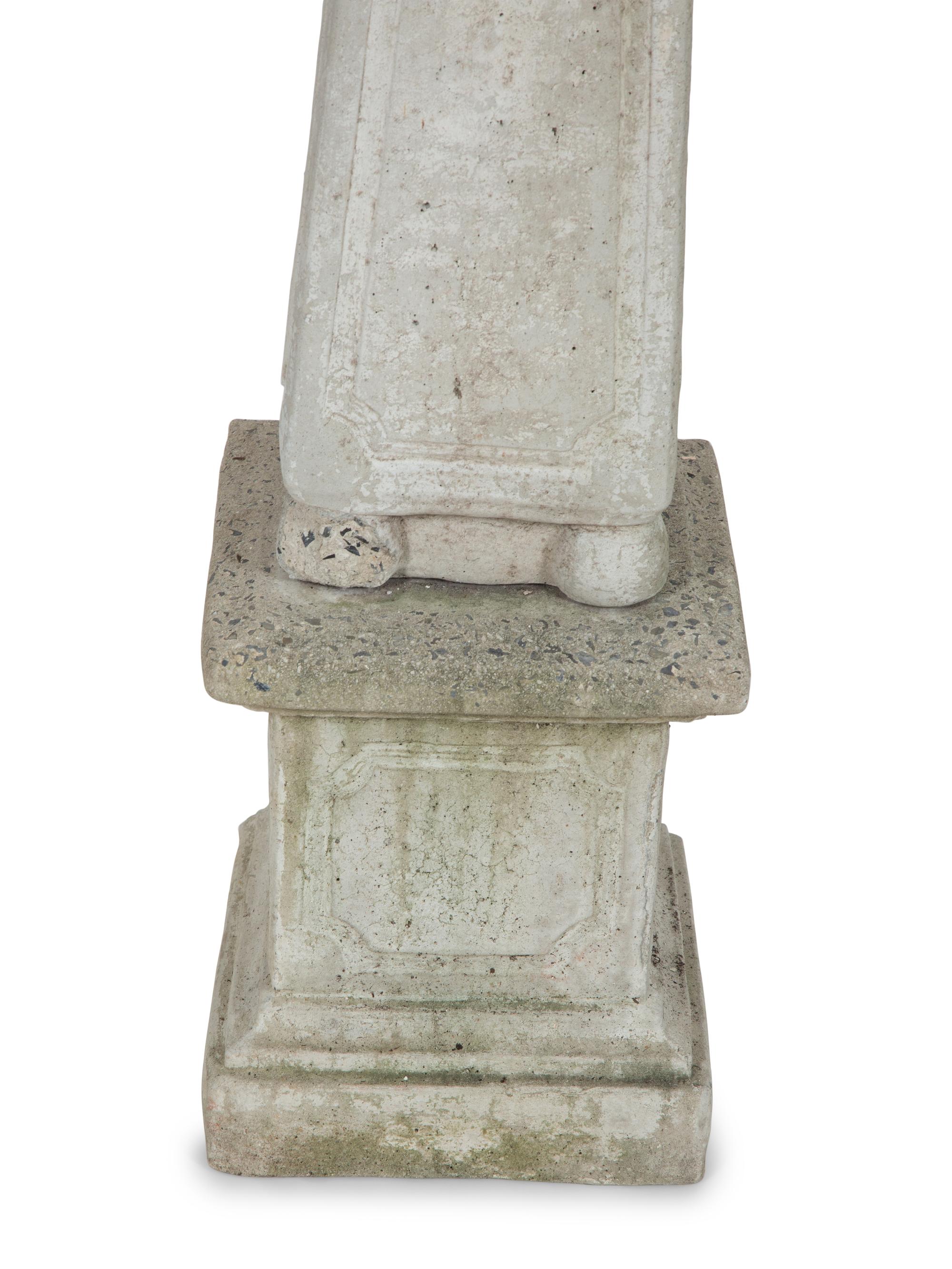 A Pair of Cast Stone Obelisks on Bases