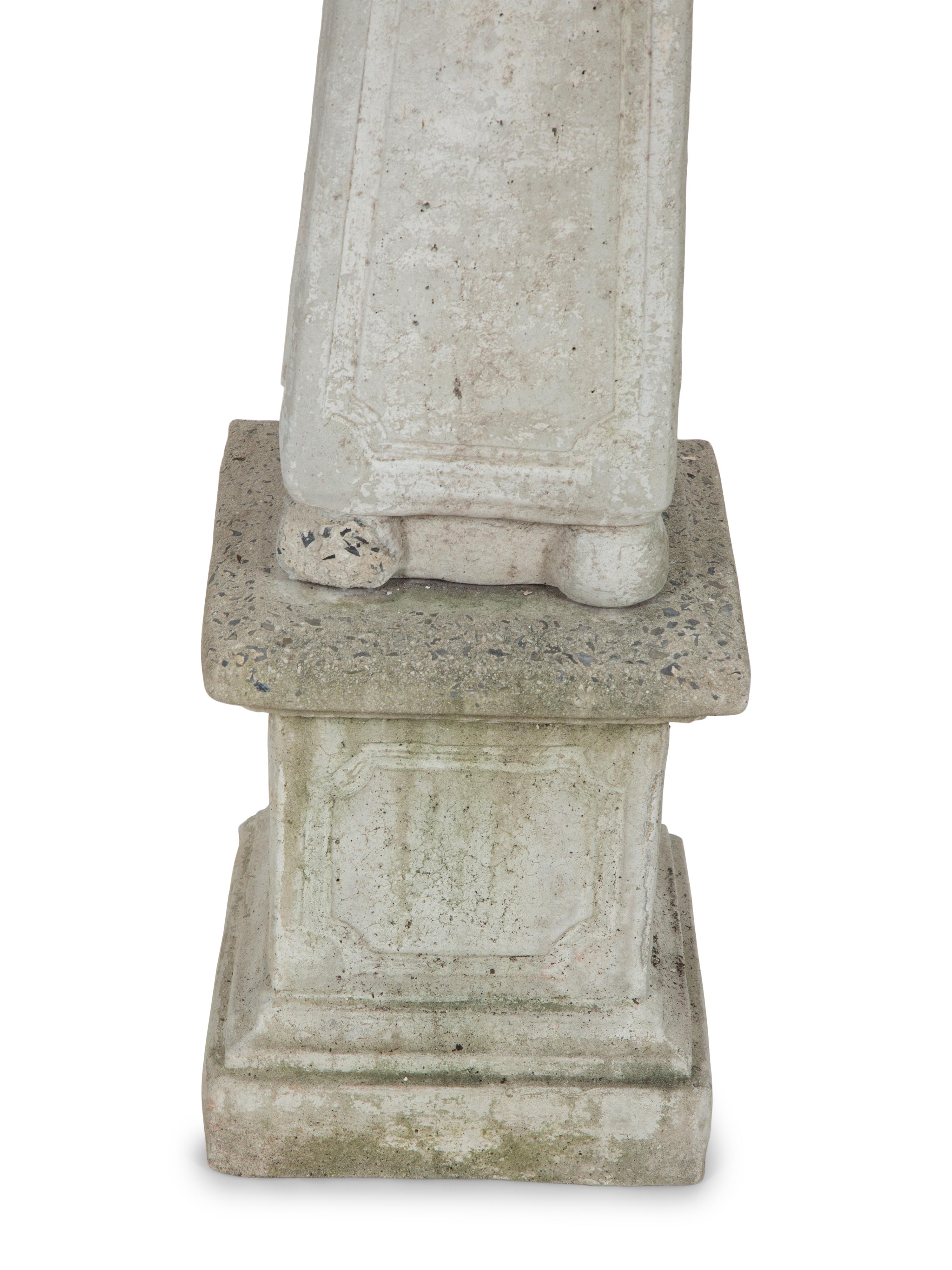 A Pair of Cast Stone Obelisks on Bases