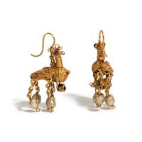 A Pair of Byzantine or Islamic Gold and Amethyst Earrings in the Form of Doves