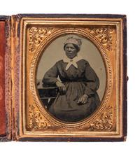 [EARLY PHOTOGRAPHY]. Sixth plate tintype featuring an African American woman. Ca 1870s.