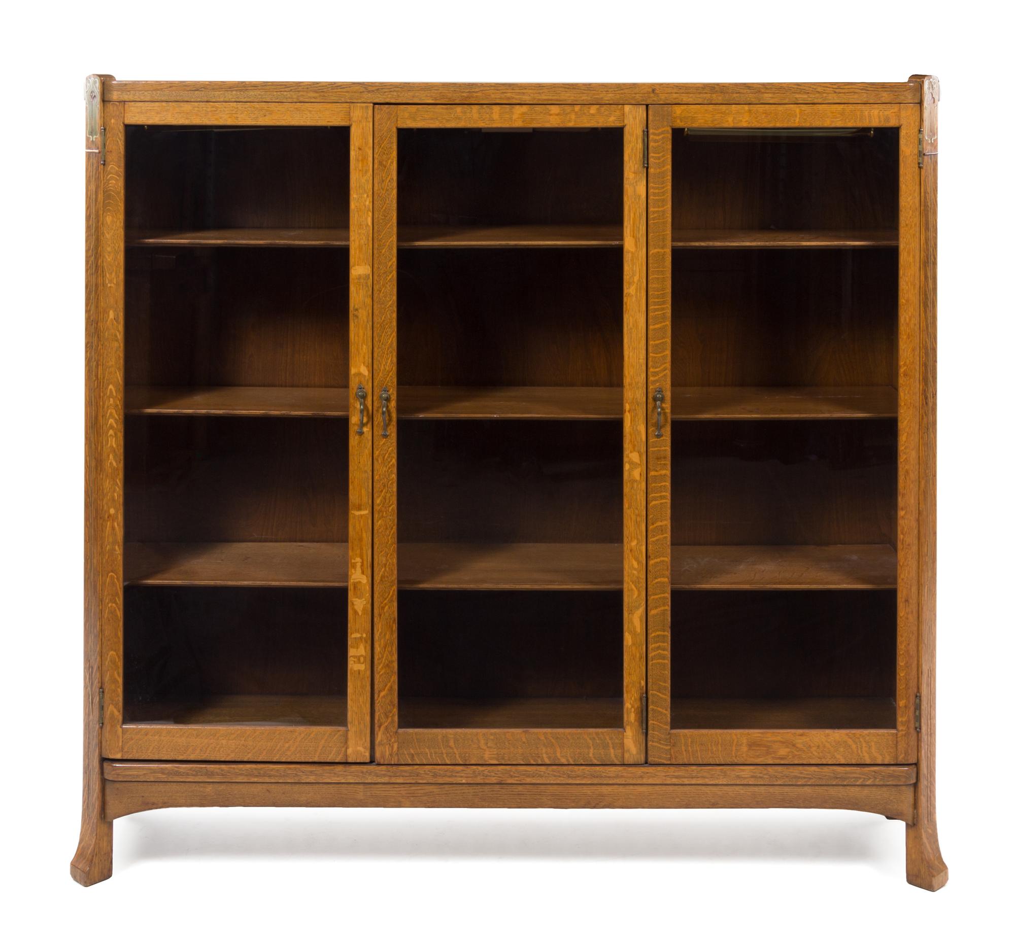 French, FIRST HALF 20TH CENTURY, an Art Nouveau style mother-of-pearl inlaid oak vitrine cabinet