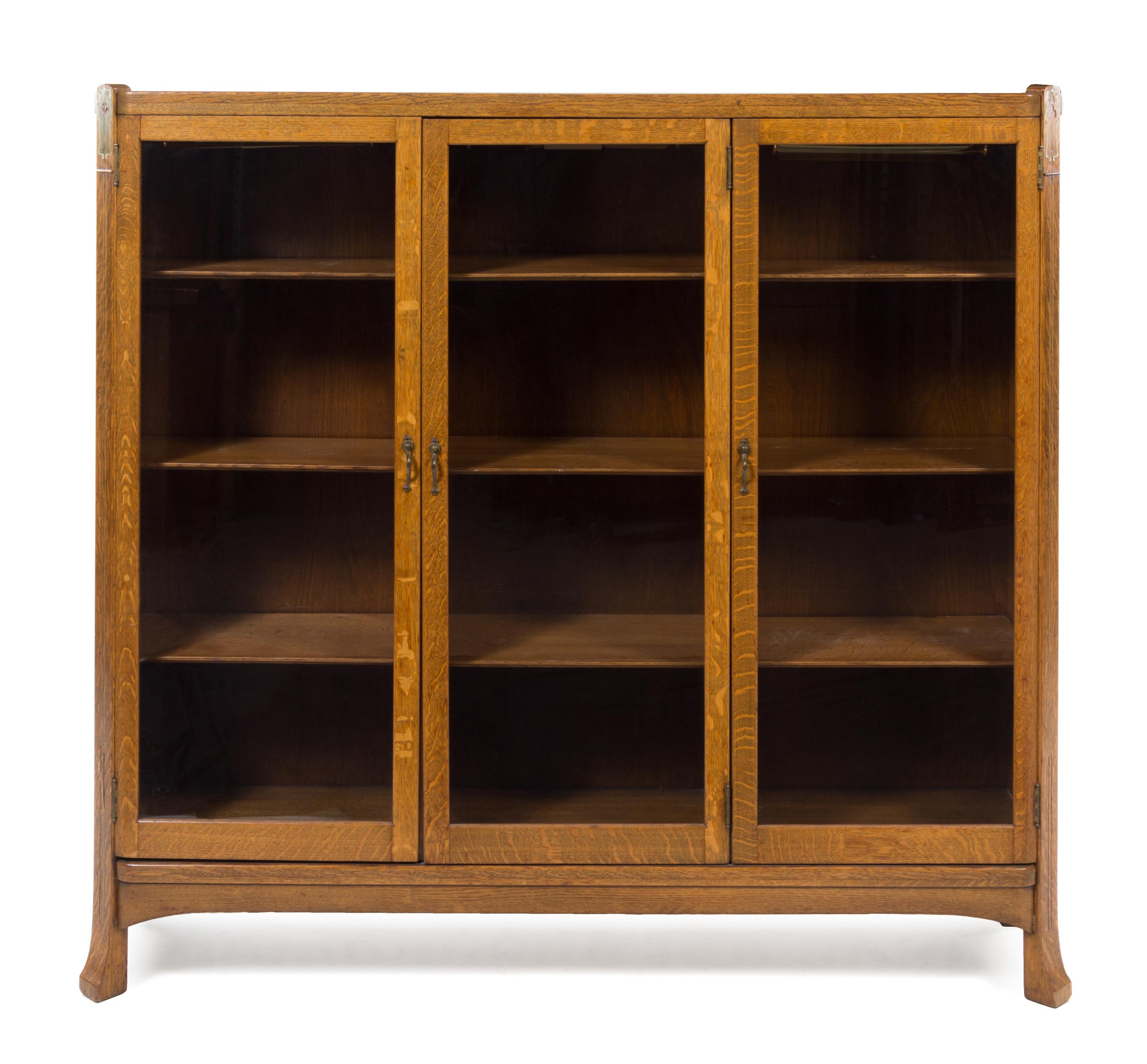 French, FIRST HALF 20TH CENTURY, an Art Nouveau style mother-of-pearl inlaid oak vitrine cabinet