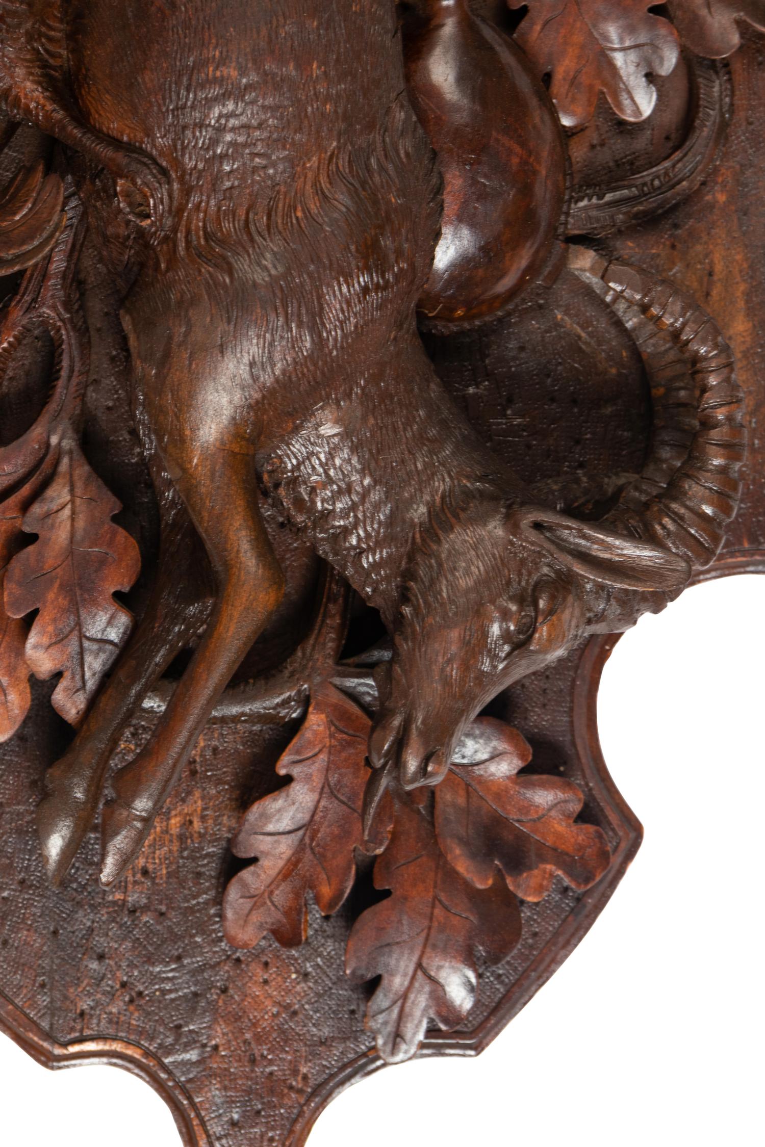 A Pair of Large Black Forest Carved Walnut Game Plaques