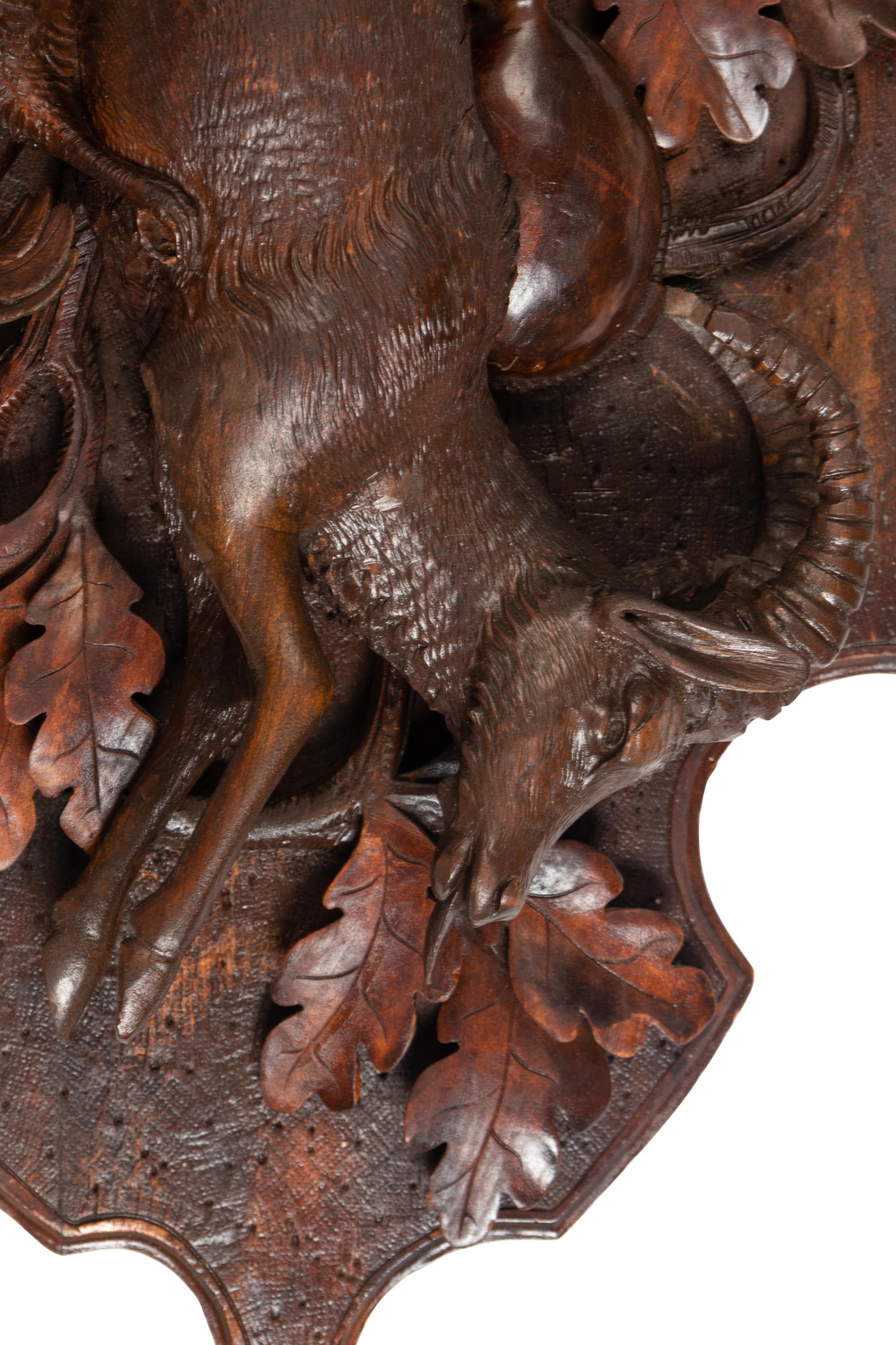 A Pair of Large Black Forest Carved Walnut Game Plaques