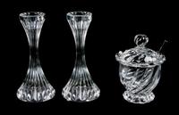 A Pair of Baccarat Glass Candlesticks Height of first 6 1/8 inches.