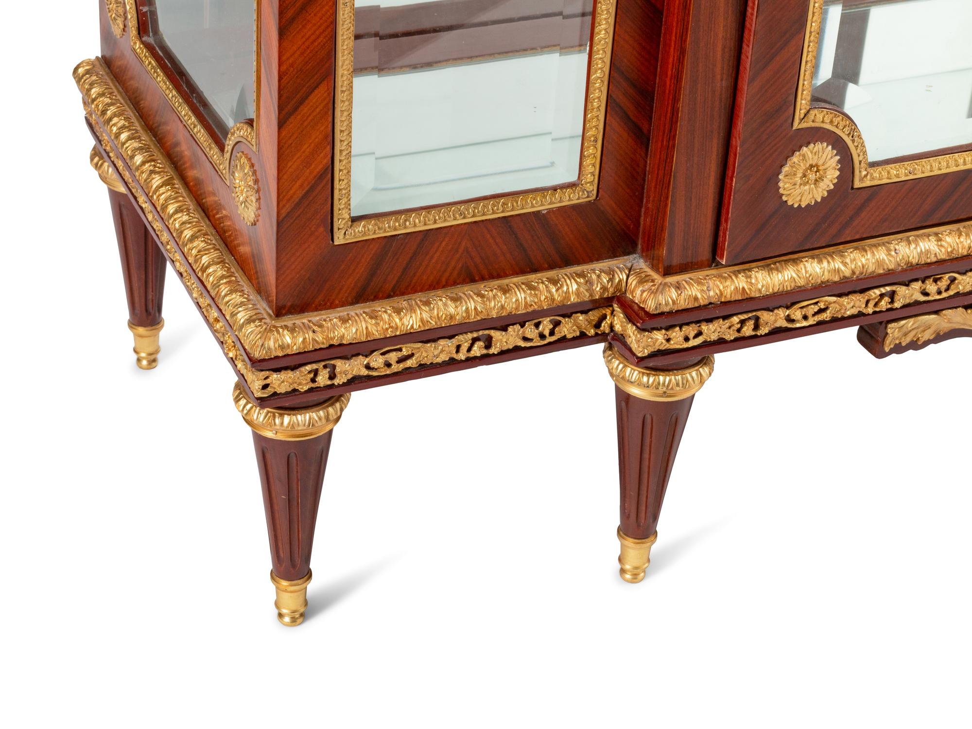 A Louis XVI Style Gilt Bronze Mounted Marble-Top Vitrine Cabinet