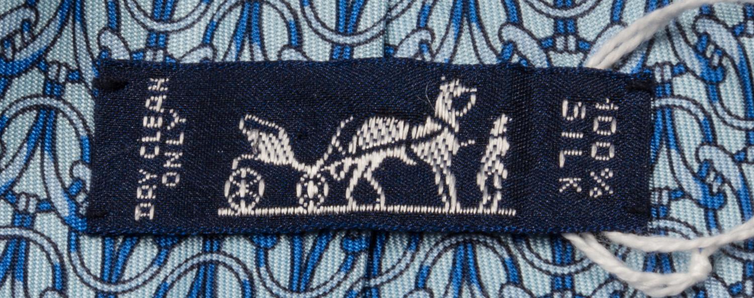 A Group of Three Hermes Silk Ties, 3.15" wide.