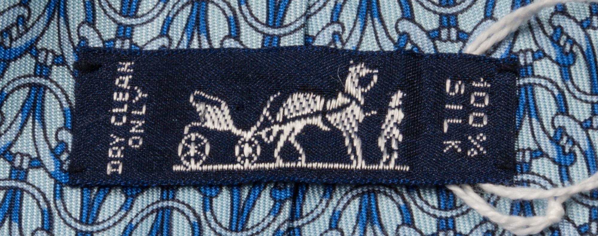 A Group of Three Hermes Silk Ties, 3.15" wide.