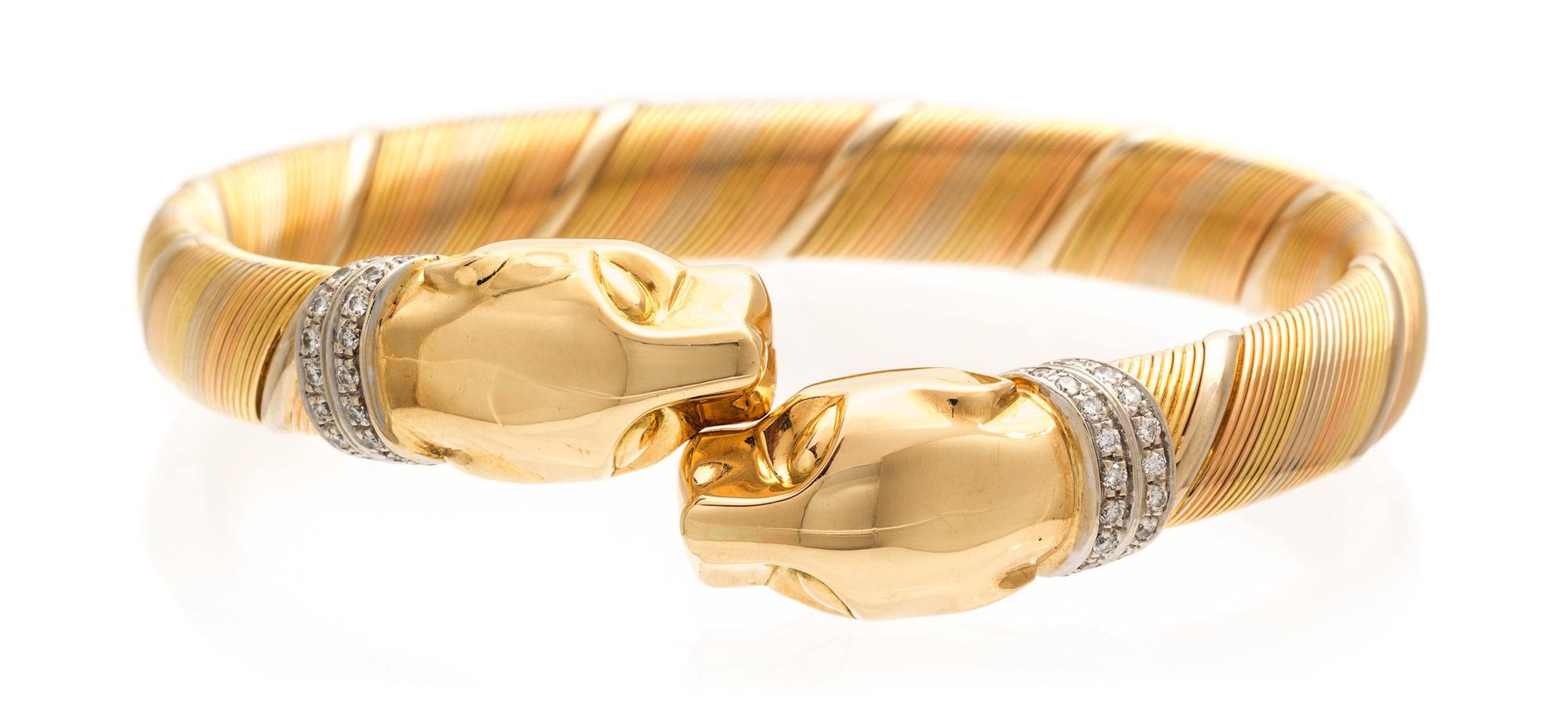 An 18 Karat Tri Color Gold and Diamond Panthere Bypass Bracelet, Cartier, Circa 1990, 31.50 dwts.