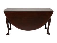 An Irish George II Style Carved Mahogany Drop Leaf Dining Table