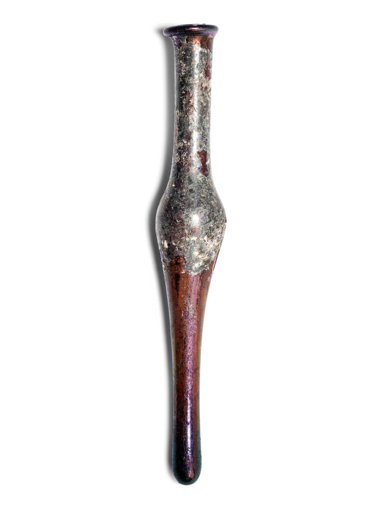 A Roman Aubergine Glass Unguentarium