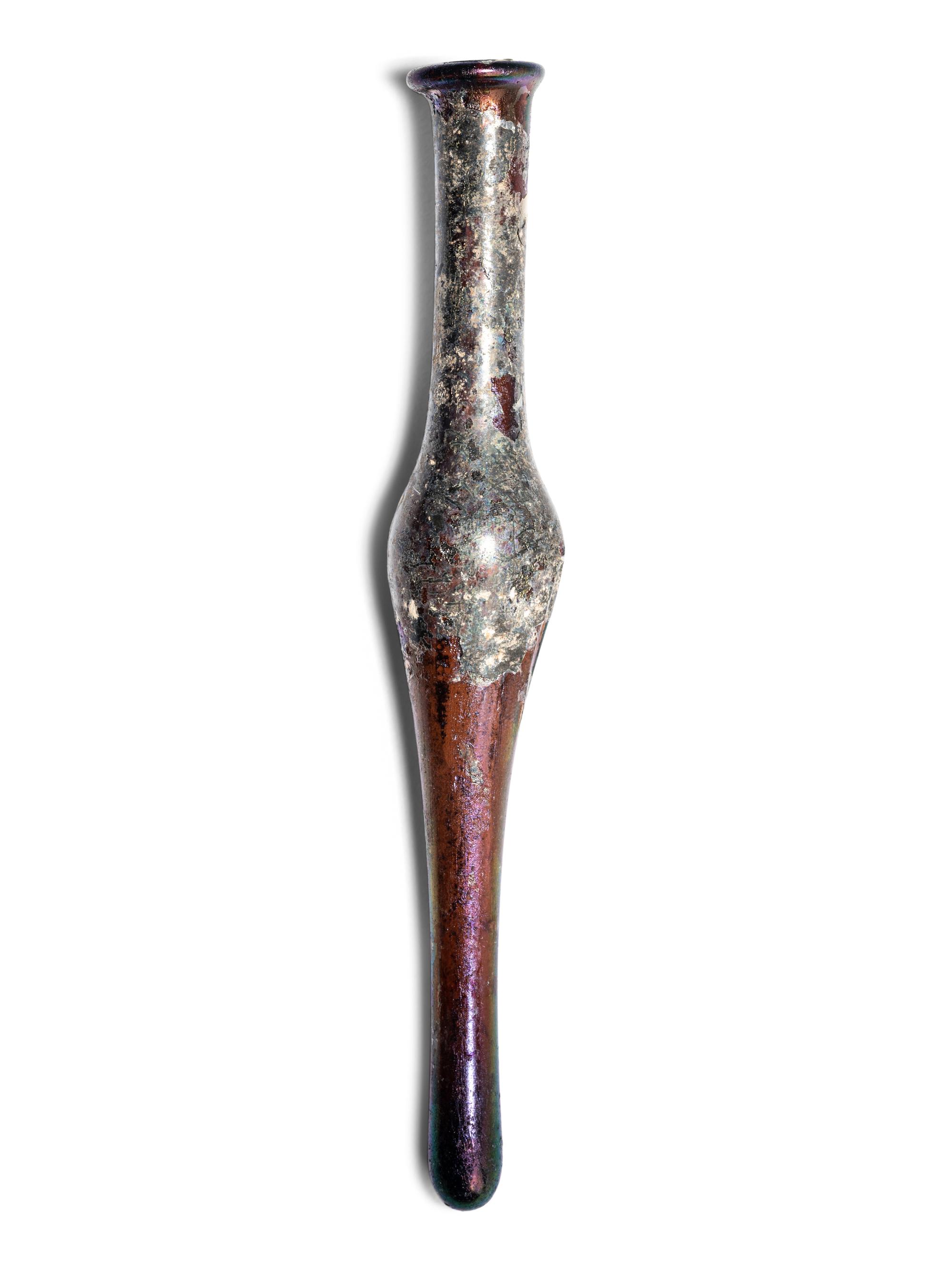 A Roman Aubergine Glass Unguentarium