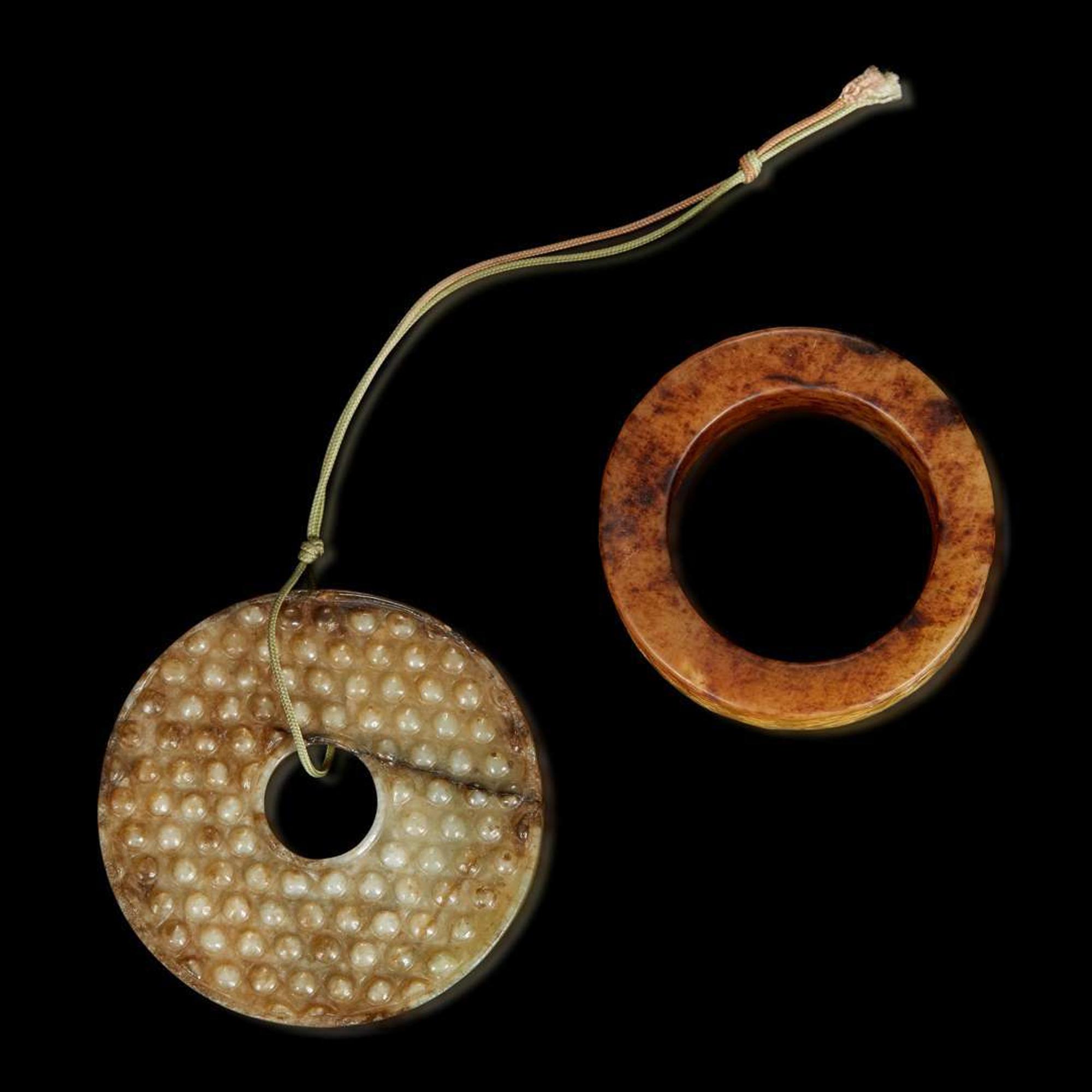 A Chinese archaistic carved beige jade bi and a large ring 高古風格玉璧與玉環各一件