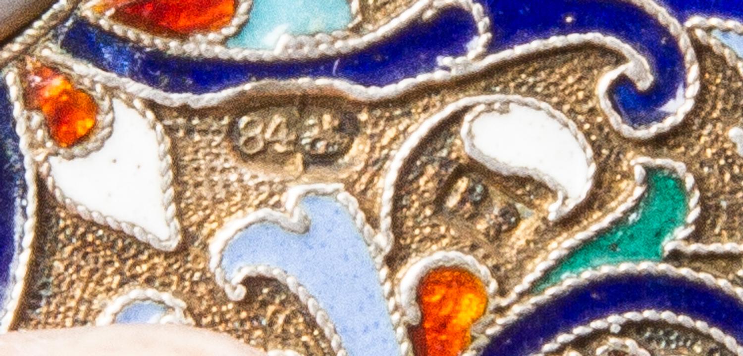 A Russian Enameled Silver Cigarette Case, Mark of Vasilii Rukavishnikov, Moscow, late 19th/early 20th century, the case decorated with