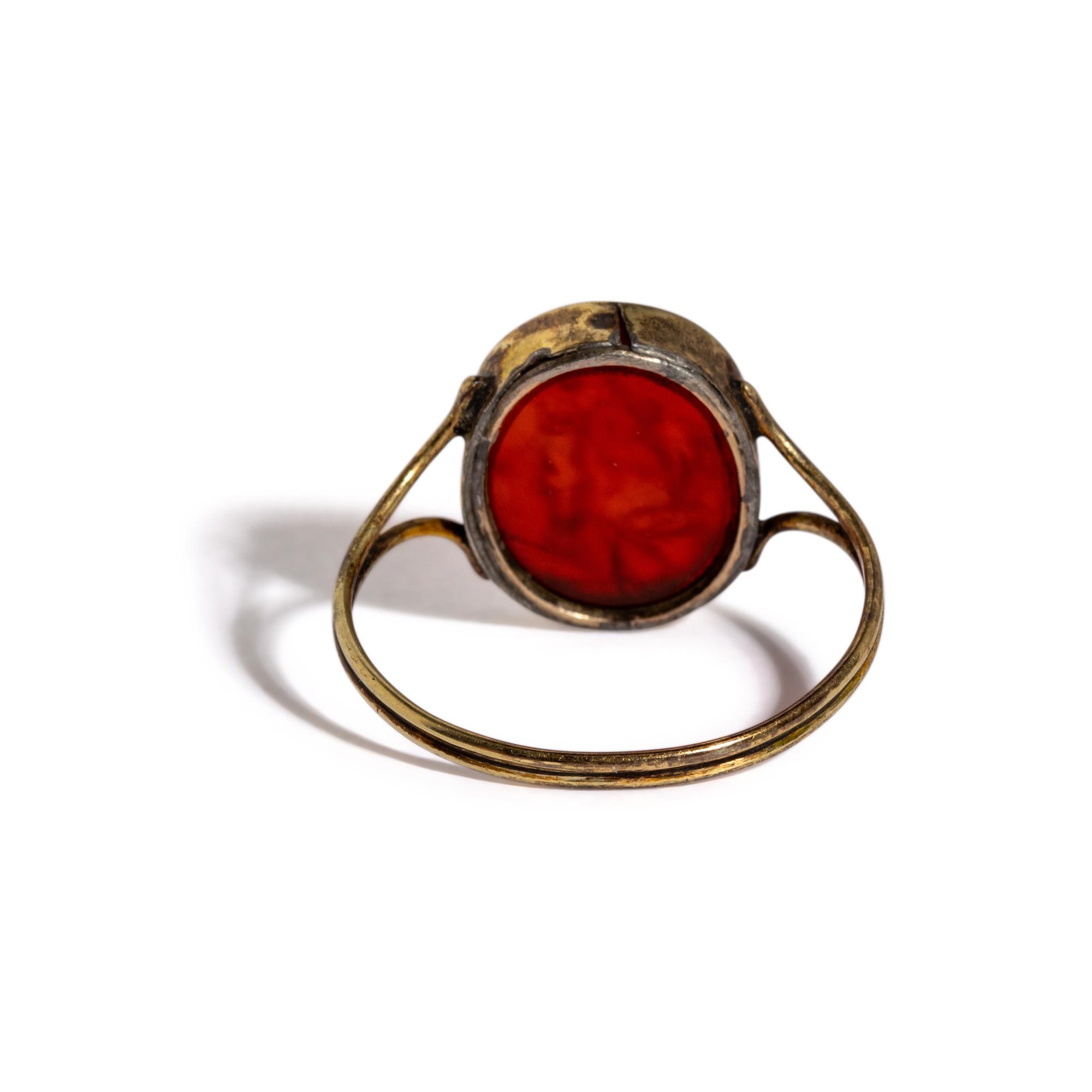A Neoclassical Carnelian and Gold Finger Ring with a Laurel Branch Offering