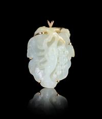 A Carved White Jade and 14K Gold Brooch — 18TH/19TH CENTURY
