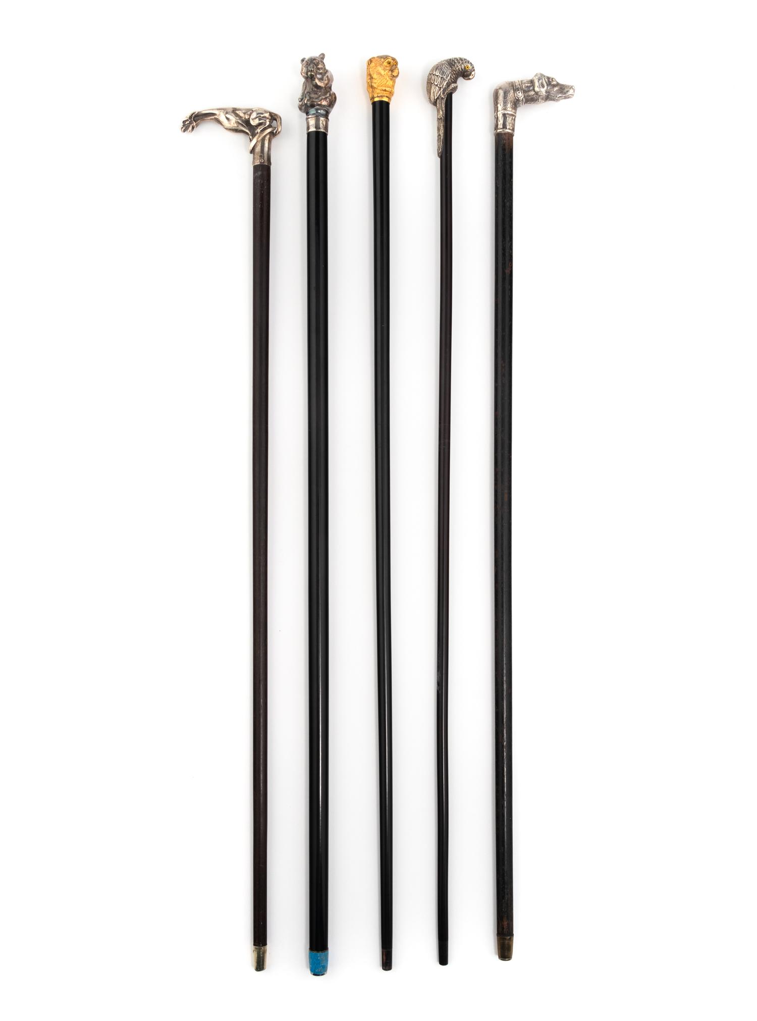 A Group of Five Silver Mounted Zoomorphic Form Walking Sticks