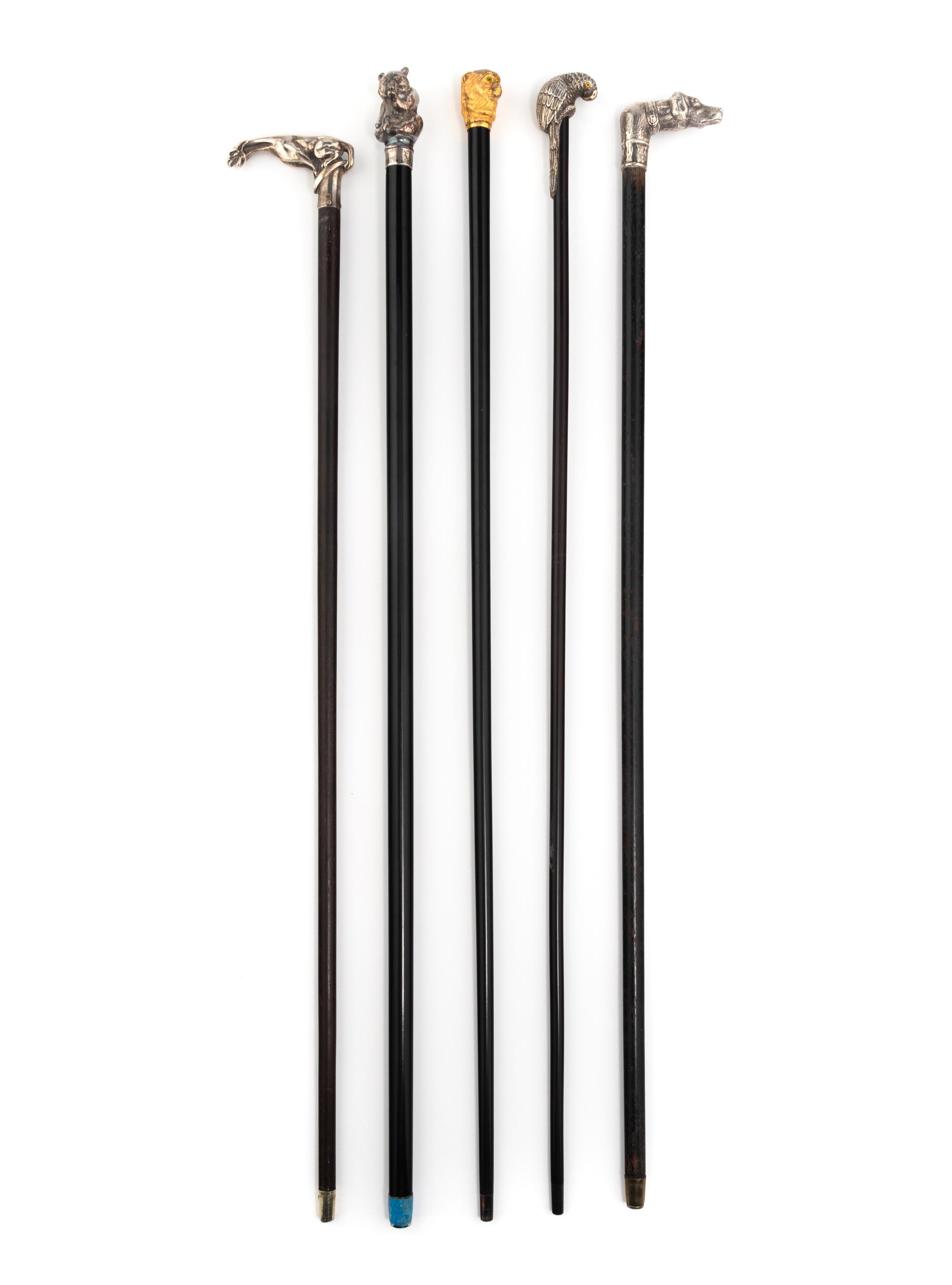 A Group of Five Silver Mounted Zoomorphic Form Walking Sticks