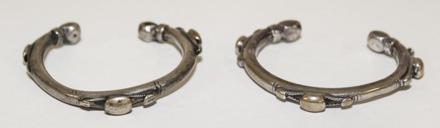 A Pair of Egyptian Silver Bangles Diameter of exterior 2 1/2 inches.