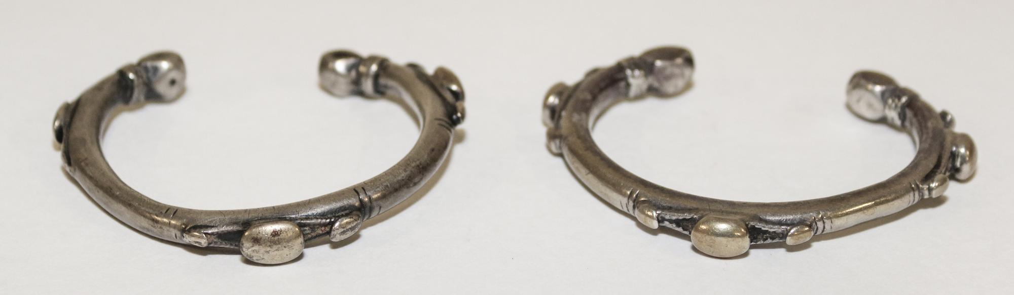 A Pair of Egyptian Silver Bangles Diameter of exterior 2 1/2 inches.