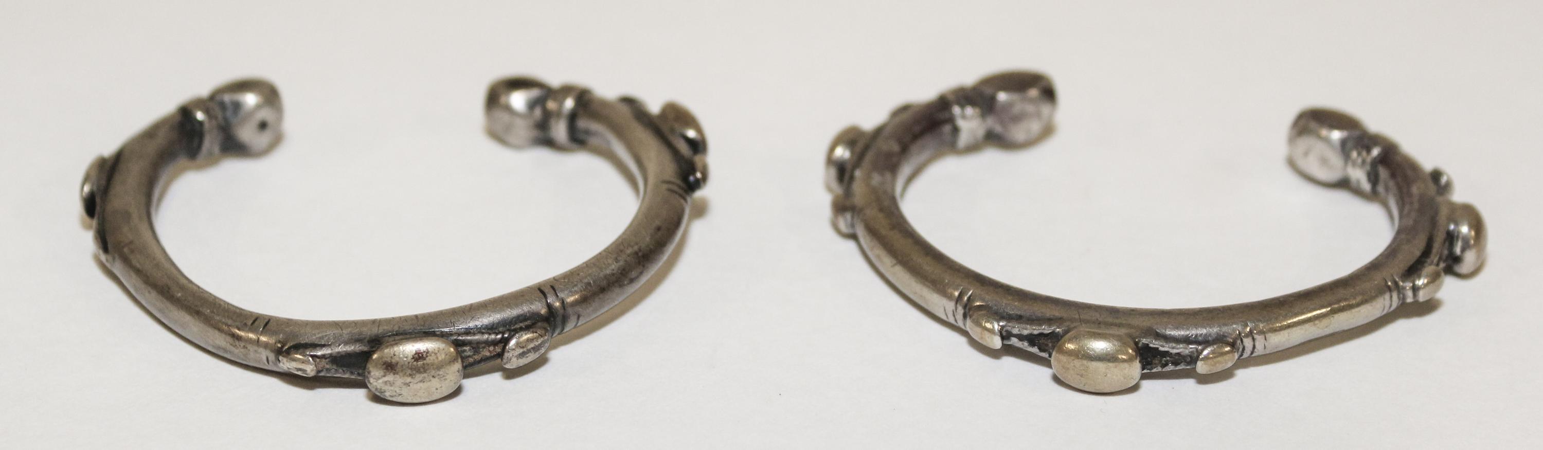 A Pair of Egyptian Silver Bangles Diameter of exterior 2 1/2 inches.