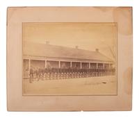 [LATE INDIAN WARS]. [MCKAY, William, photog., attrib.]. 2 photographs of US soldiers near barracks.